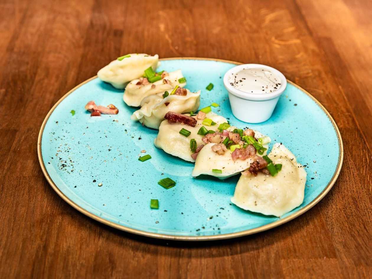 Dumplings with duck and roast sauce