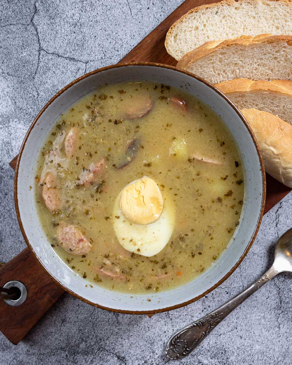 Polish sour soup with egg and sausage