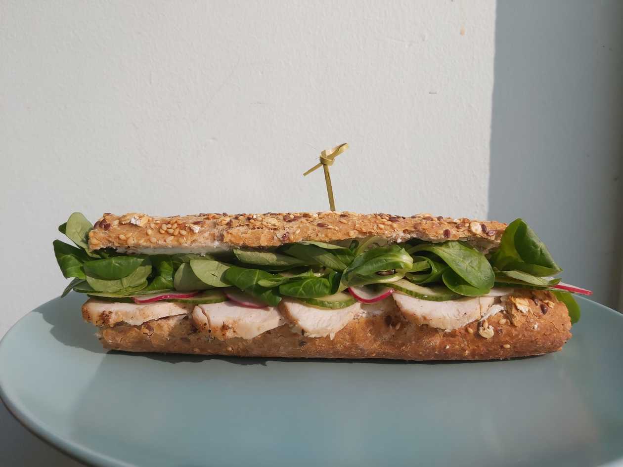 Baguette with chicken, cream cheese, vegetables and lettuce