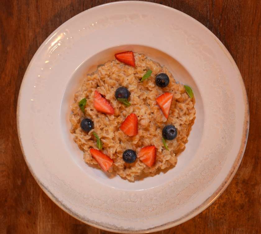 Sweet oatmeal with seasonal fruits, choice of