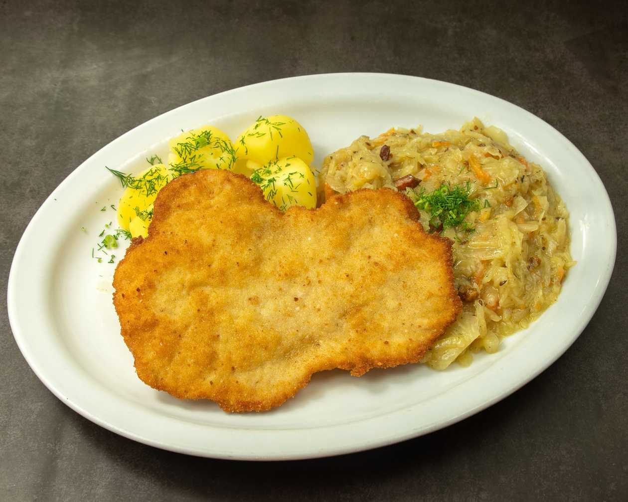 Pork chop with potatoes and salad