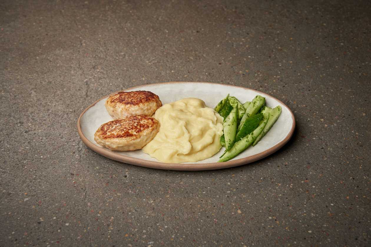 Chicken cutlets with mashed potatoes and lightly salted cucumbers