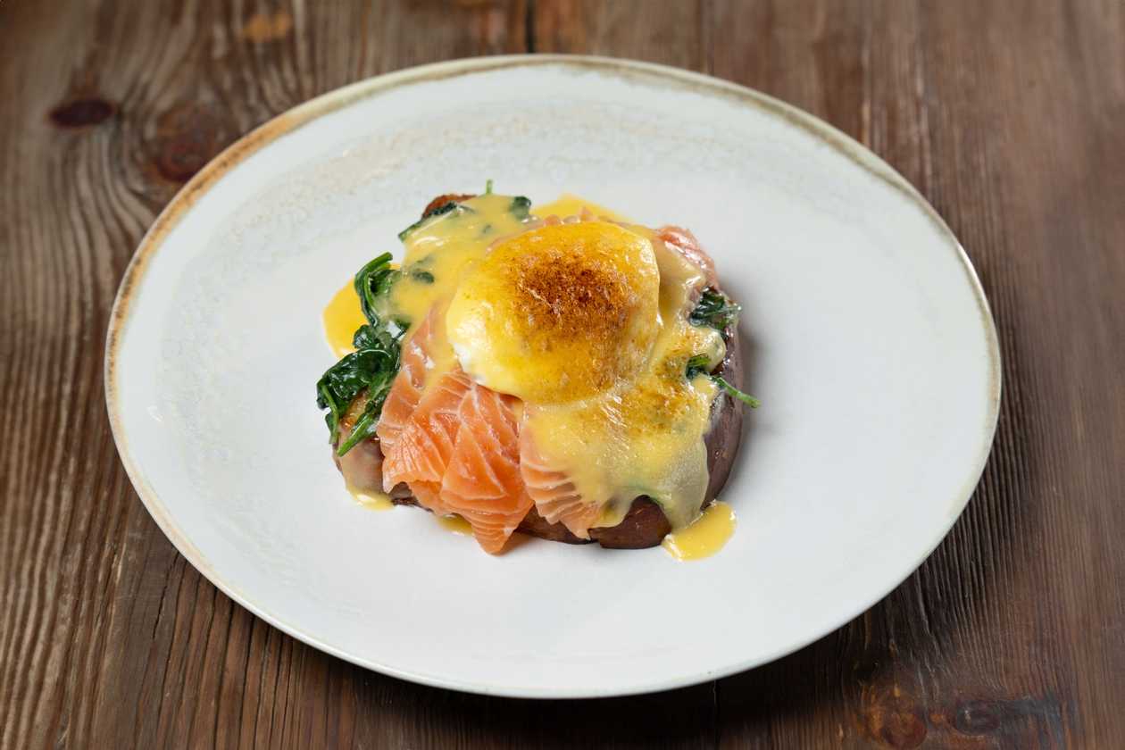 Eggs Benedict with Hollandaise Sauce, Spinach, and Salmon